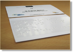 Braille self adhesive label on a business card